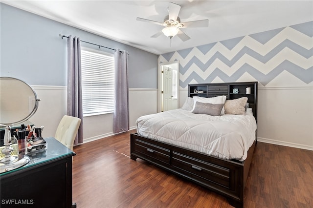 bedroom featuring ceiling fan and dark hardwood / wood-style flooring