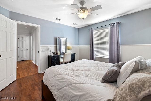 bedroom with ceiling fan and dark wood-type flooring