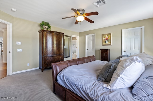 bedroom with ceiling fan and light colored carpet