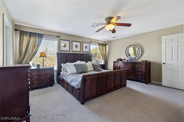 bedroom featuring ceiling fan and light carpet