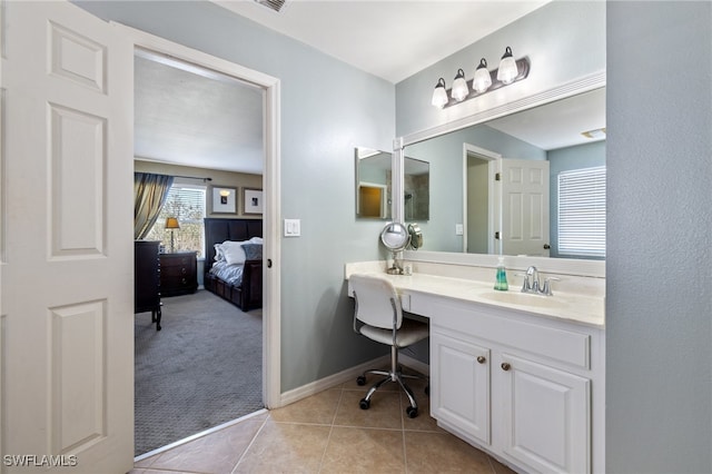 bathroom featuring tile patterned floors and vanity