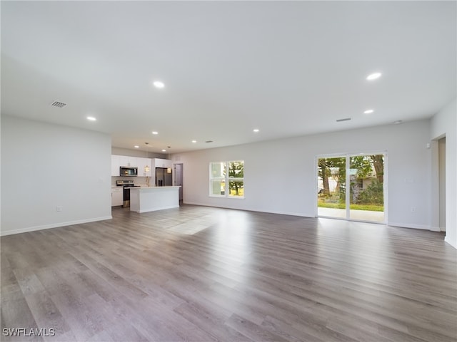 unfurnished living room featuring light hardwood / wood-style flooring