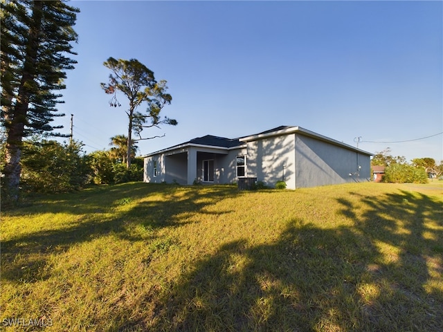 view of property exterior featuring a yard