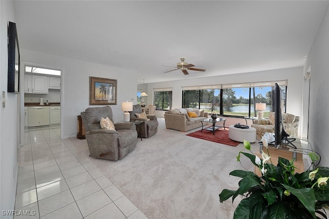 living room featuring ceiling fan and light tile patterned flooring