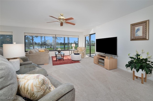 living room featuring carpet floors and ceiling fan