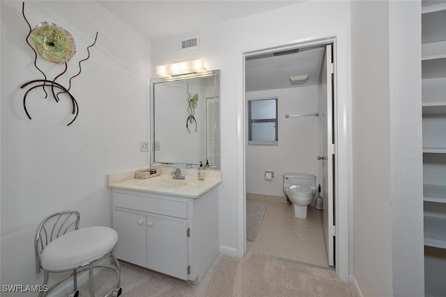 bathroom with vanity and toilet