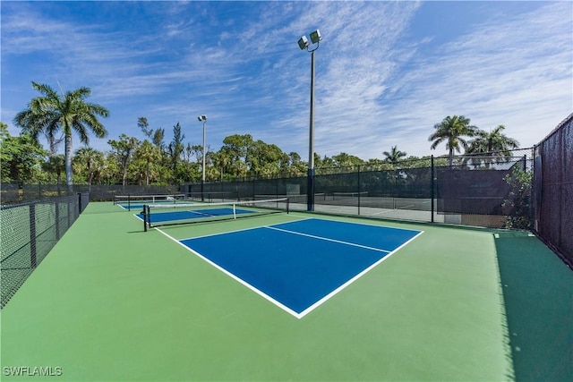 view of sport court with basketball hoop