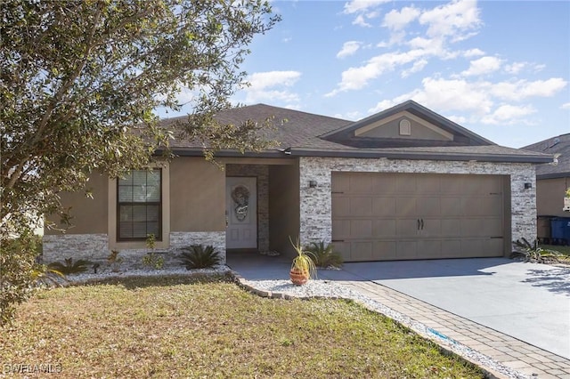 ranch-style home with a garage and a front yard