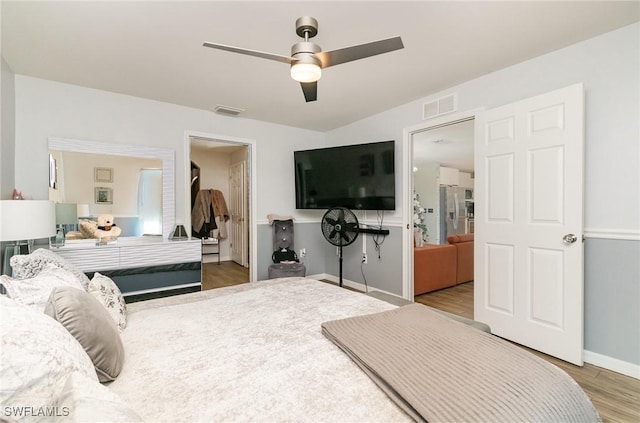 bedroom featuring ceiling fan and wood-type flooring