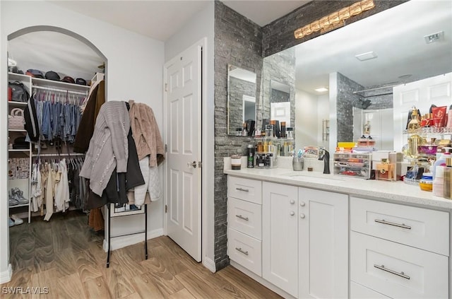 bathroom featuring hardwood / wood-style flooring and vanity