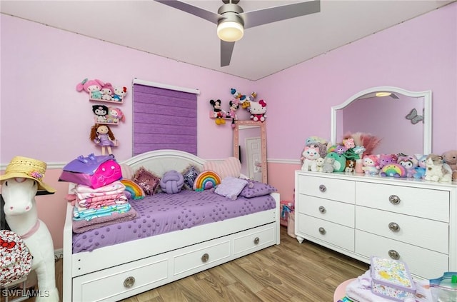 bedroom featuring ceiling fan and wood-type flooring