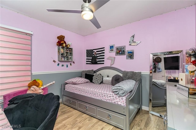 bedroom featuring light wood-type flooring and ceiling fan