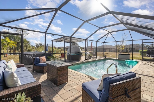 view of pool with a lanai, a patio area, and outdoor lounge area