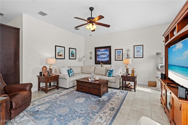 tiled living room featuring ceiling fan