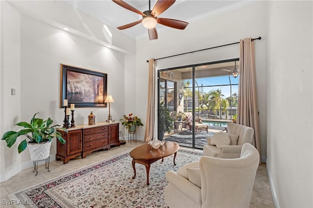 living room with crown molding, light tile patterned floors, and ceiling fan