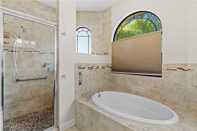 bathroom with shower with separate bathtub