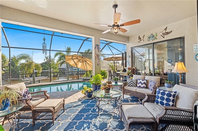 sunroom featuring ceiling fan