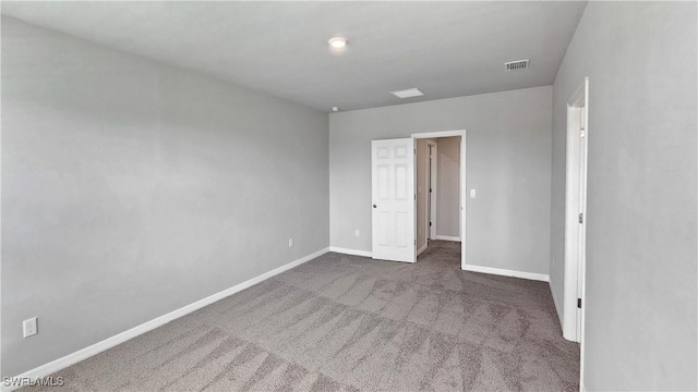 spare room featuring carpet flooring