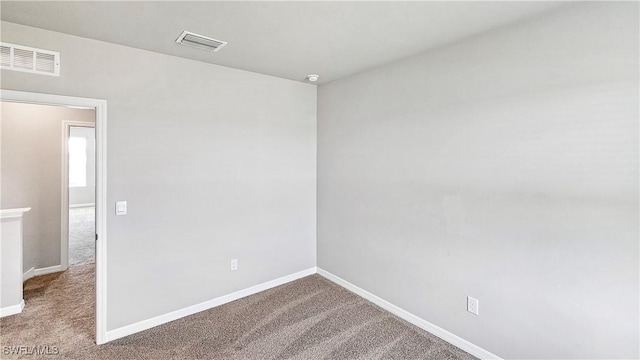 empty room with carpet flooring