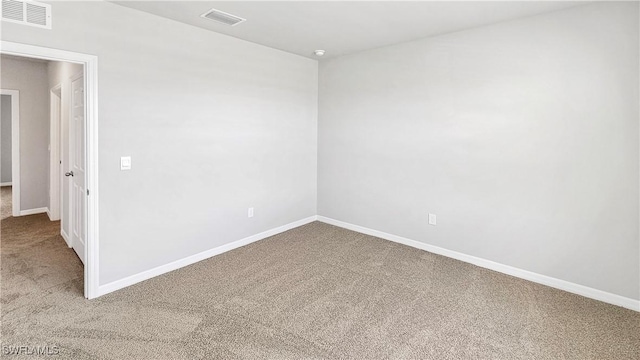 spare room featuring carpet