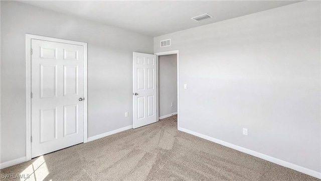 unfurnished bedroom with light carpet