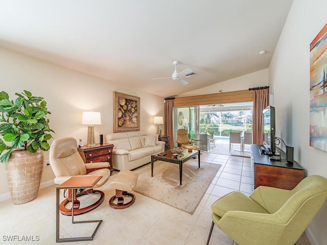 living room featuring light tile patterned floors, vaulted ceiling, and ceiling fan