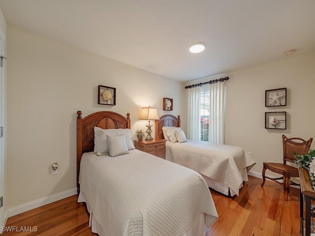 bedroom with light hardwood / wood-style flooring