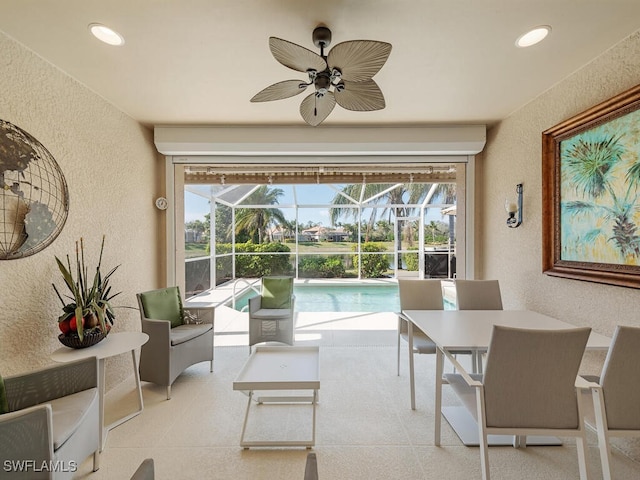 interior space featuring ceiling fan and a healthy amount of sunlight