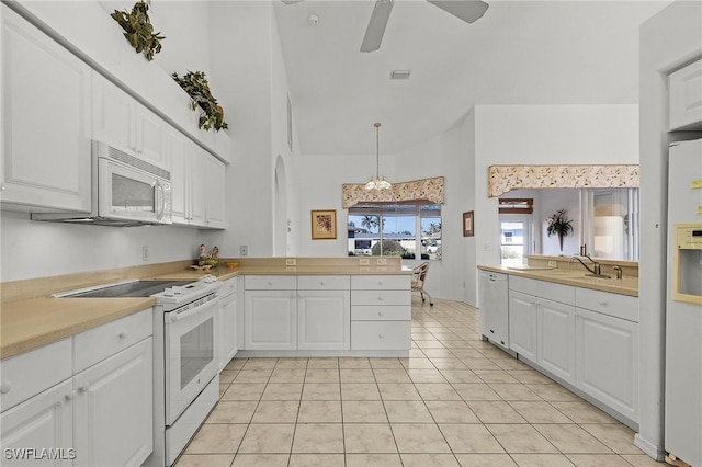 kitchen featuring white cabinets, white appliances, and decorative light fixtures