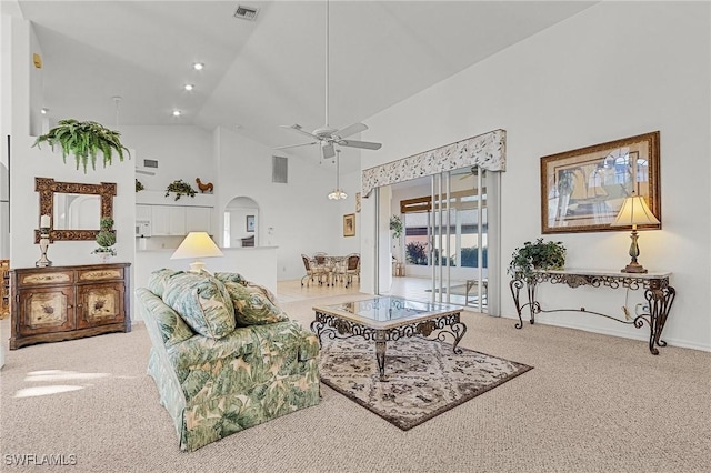 living room with carpet, high vaulted ceiling, and ceiling fan