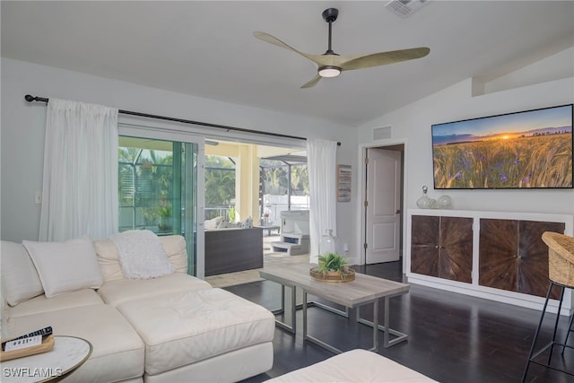 living room featuring dark hardwood / wood-style flooring, ceiling fan, and lofted ceiling