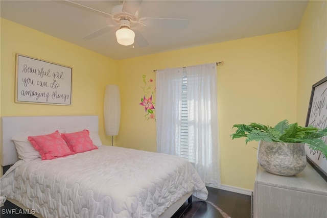 bedroom featuring ceiling fan and wood-type flooring