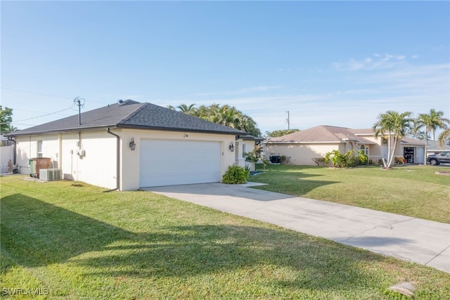 view of home's exterior featuring a yard, a garage, and central AC unit