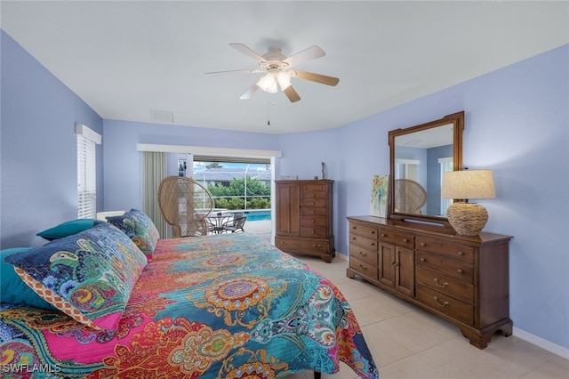 tiled bedroom featuring ceiling fan and access to outside