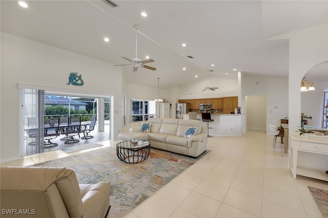 tiled living room featuring high vaulted ceiling and ceiling fan