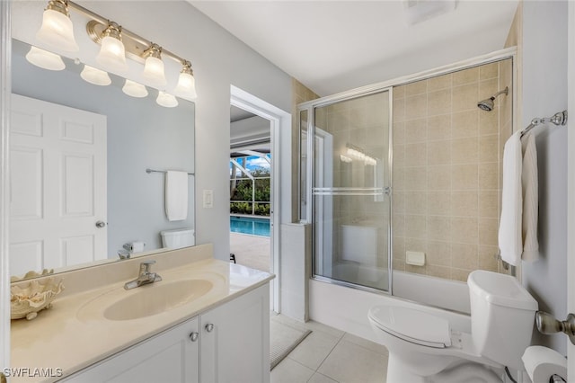 full bathroom featuring toilet, tile patterned floors, vanity, and enclosed tub / shower combo