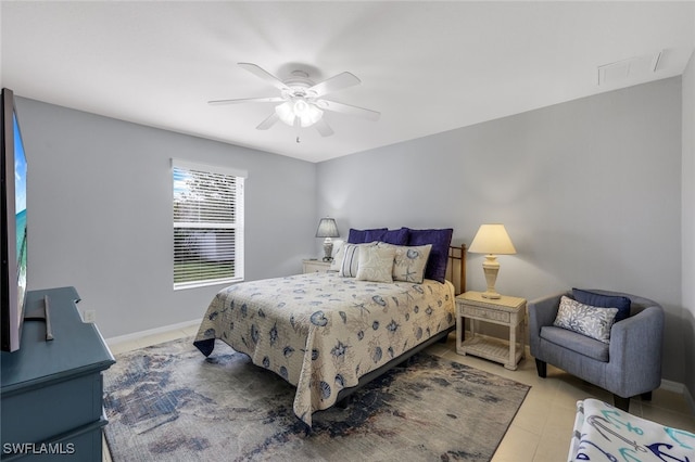 tiled bedroom featuring ceiling fan