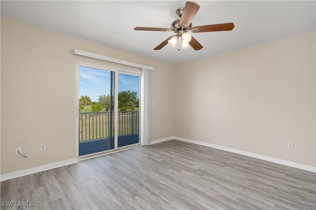 unfurnished room featuring ceiling fan and light wood-type flooring