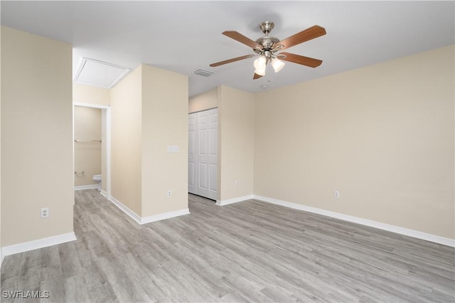 spare room with ceiling fan and light hardwood / wood-style floors