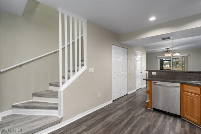 kitchen featuring dishwasher, dark hardwood / wood-style floors, and a notable chandelier