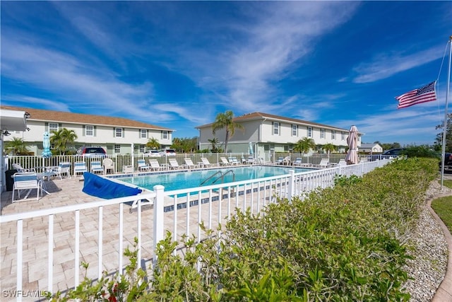 view of swimming pool with a patio