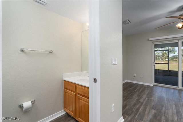 bathroom with vanity, ceiling fan, and wood-type flooring