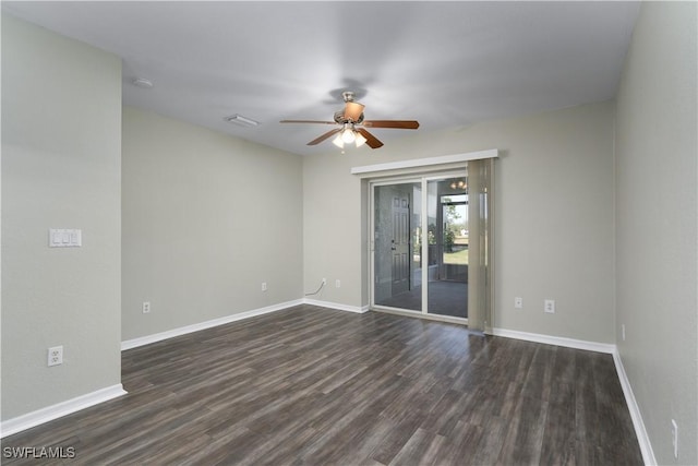 empty room with dark hardwood / wood-style floors and ceiling fan