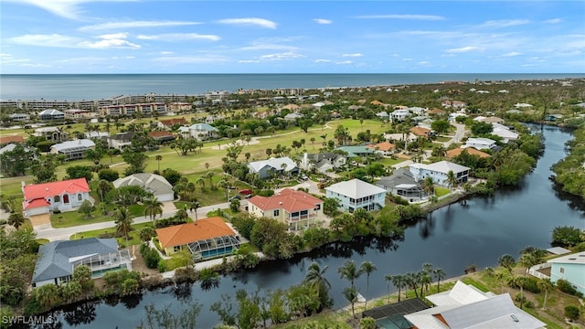 drone / aerial view with a water view