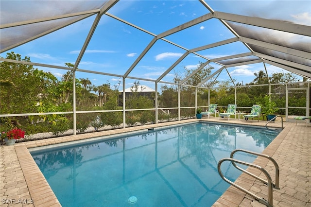 view of pool featuring a patio area and a lanai