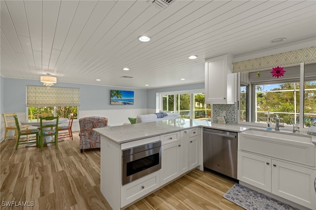 kitchen with dishwasher, white cabinetry, wooden ceiling, and kitchen peninsula