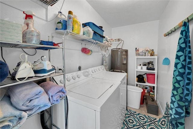 laundry area featuring electric water heater and independent washer and dryer