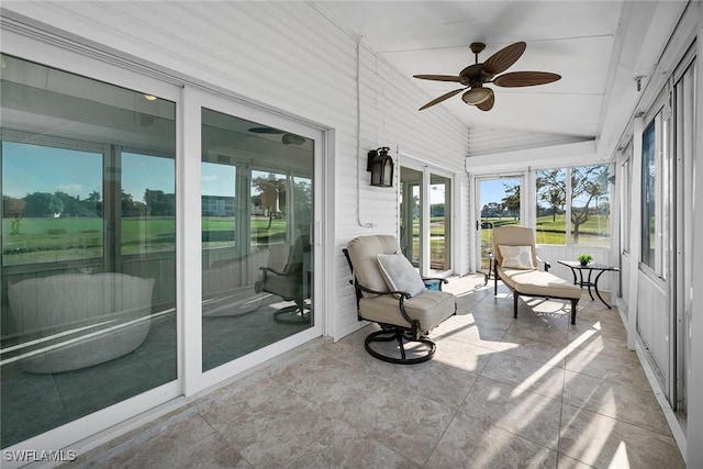 sunroom / solarium featuring vaulted ceiling and ceiling fan