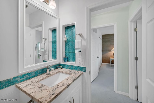 bathroom featuring tile walls and vanity