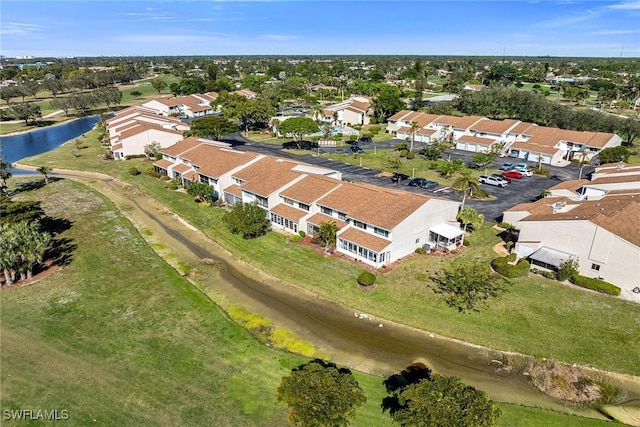 birds eye view of property featuring a residential view and a water view